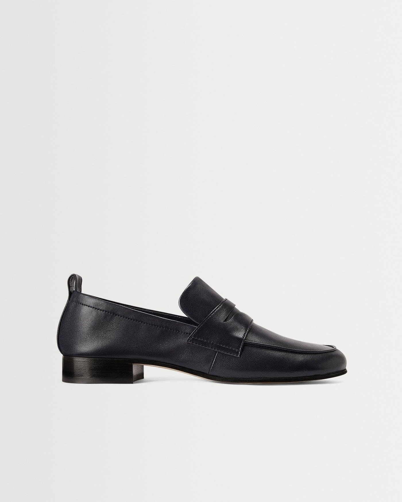 A sleek side view of the Fez Penny Loafer in Navy