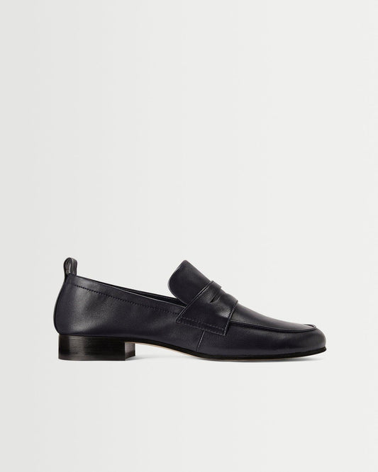 A sleek side view of the Fez Penny Loafer in Navy