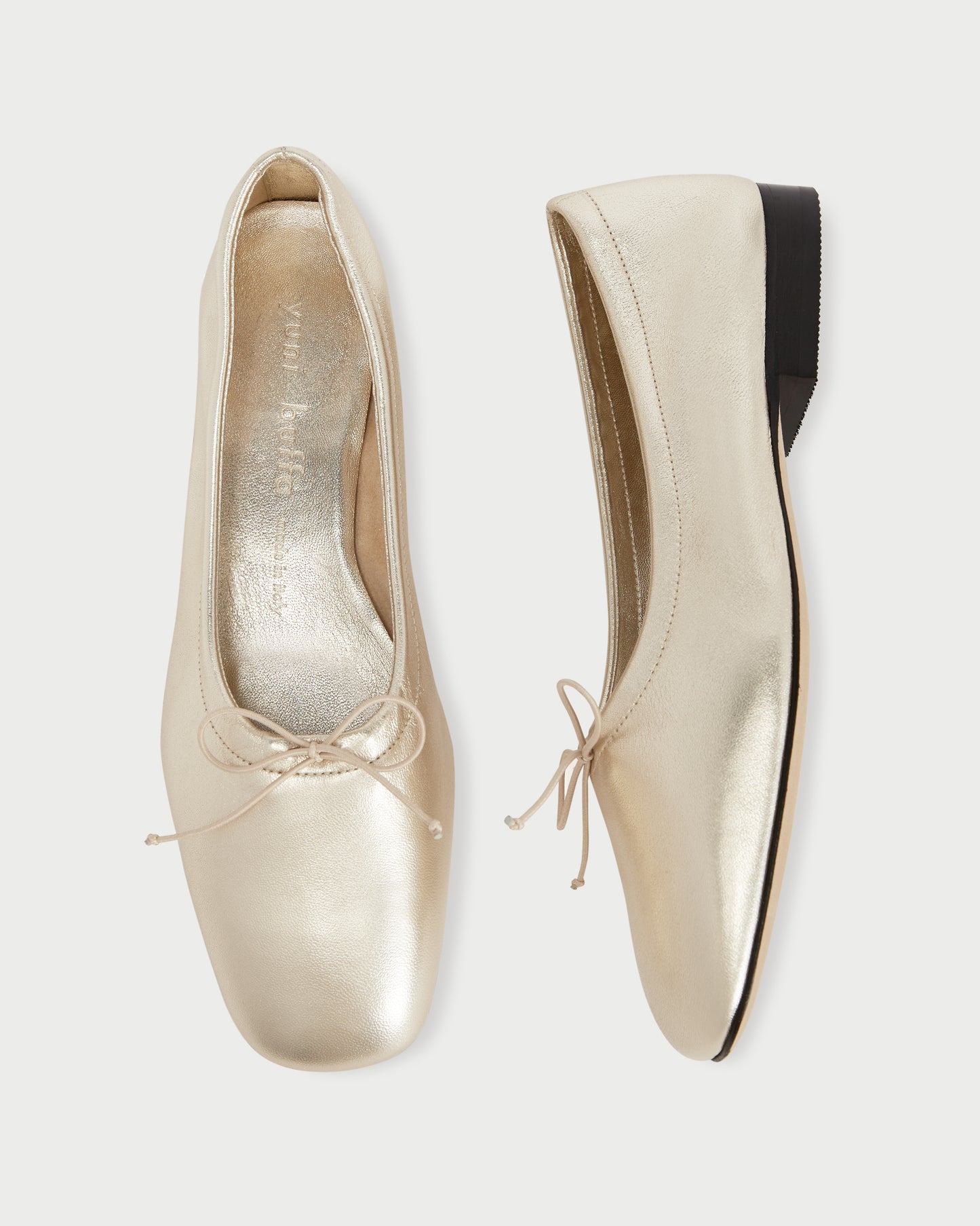 Top and side view of Pia Ballerina Comet gold flats