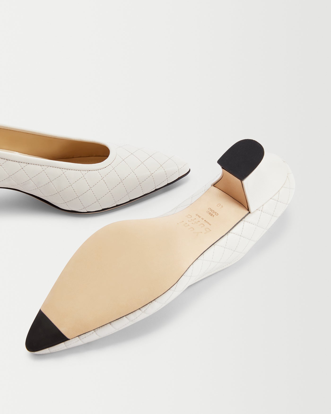 Close-up of ROMA PUMP - CLOUD sole and quilted pattern.