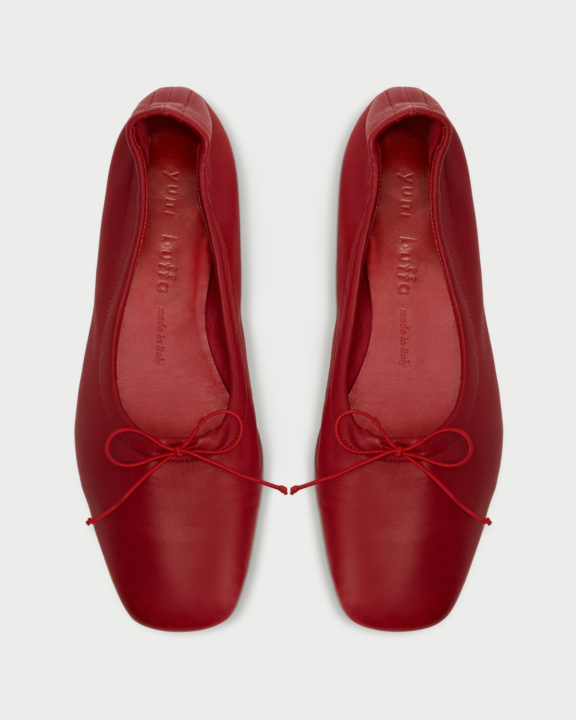 Close-up of Pia Ballerina Cherry flats with bow detail