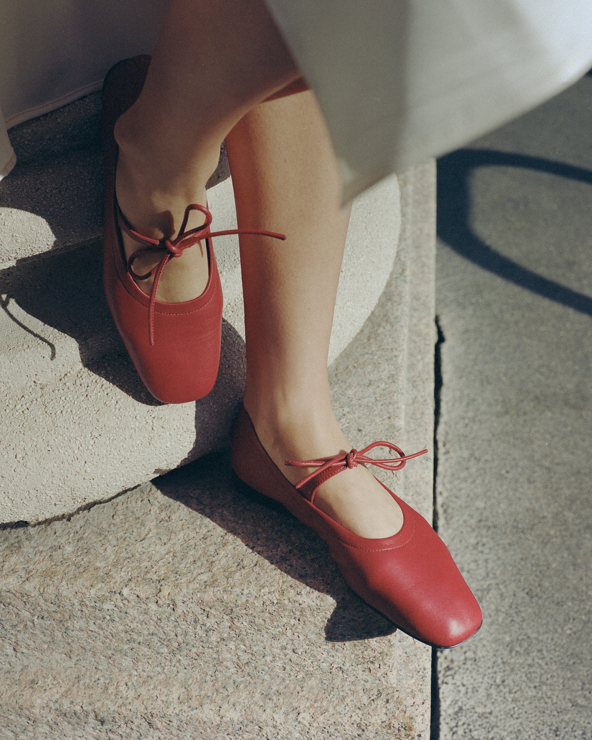 Lola Mary Jane Cherry flats worn outdoors in soft sunlight
