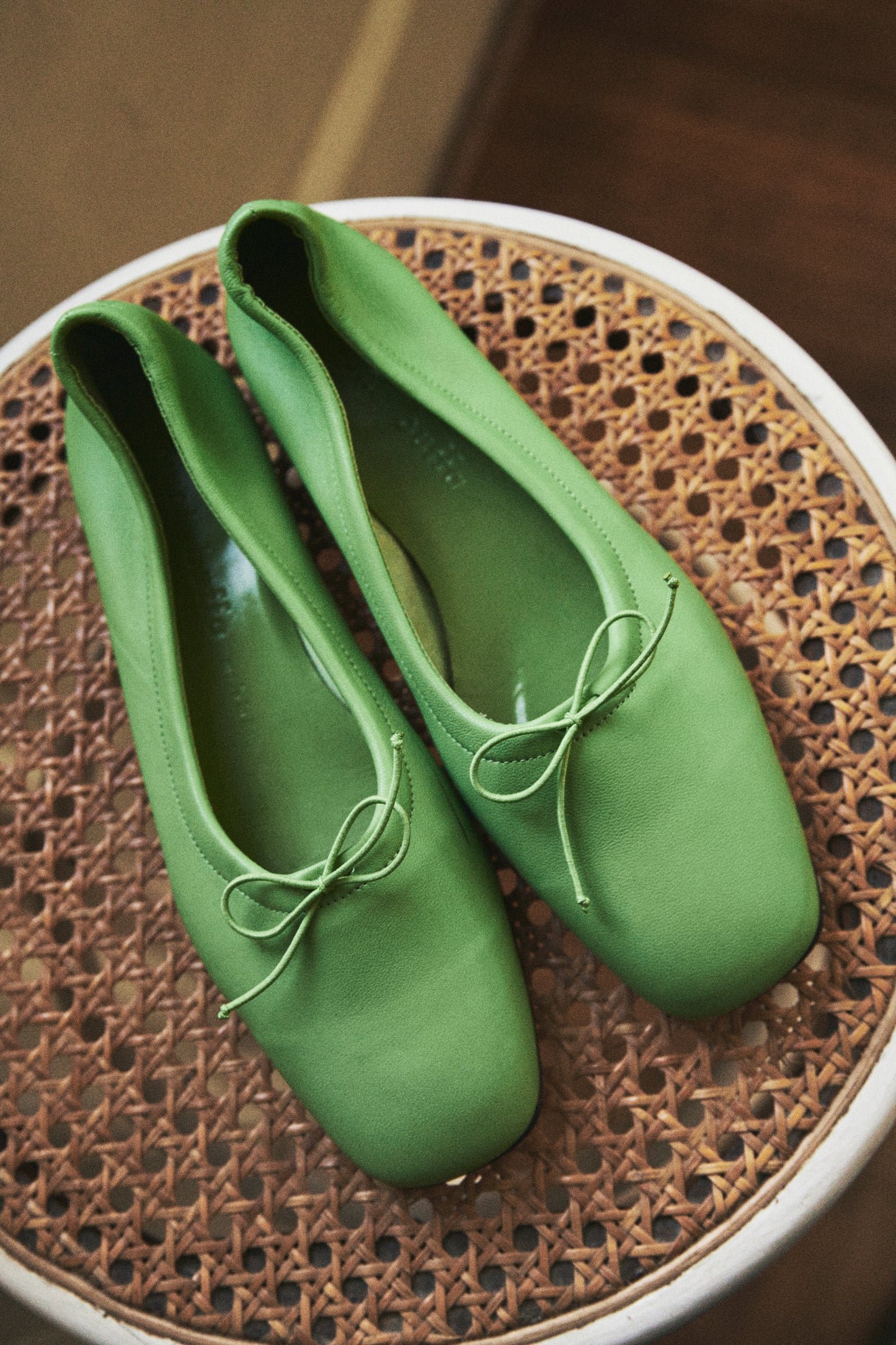 Close-up of Pia Ballerina Citron flats with refined details