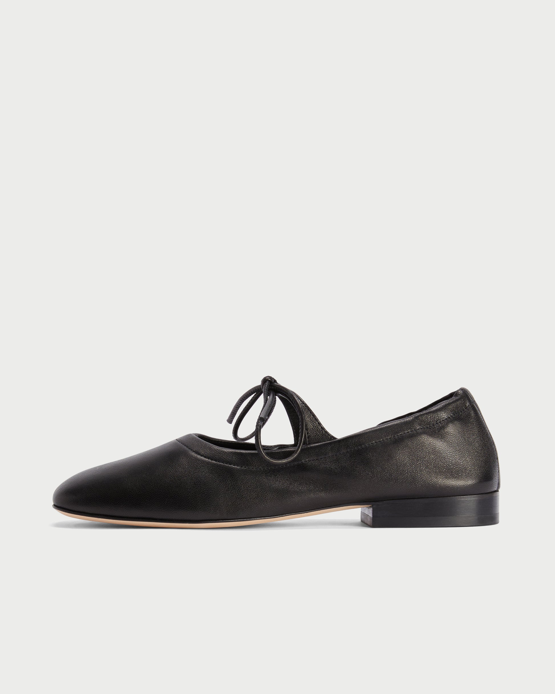 Side view of Lola Mary Jane Black flats with lace-up detail