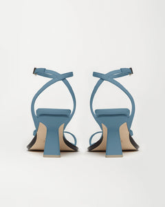 Back view of designer women's sandals Yuni Buffa Castrise strappy sandal high Heel in Bermuda blue color made in Italy with Italian Lamb Nappa leather and silver logo buckle