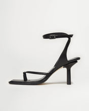 Load image into Gallery viewer, Side view of Yuni Buffa Castrise high Heel women strappy sandal in Black. Artisanal crafted woman shoe made in Italy with Italian Lamb Nappa leather and silver logo buckle