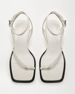 Top view of designer sandals Yuni Buffa Castrise strappy sandal high Heel in Cloud White color handmade in Italy with Italian Lamb Nappa leather and silver logo buckle
