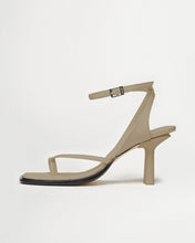 Load image into Gallery viewer, Side view of Yuni Buffa Castrise high Heel women strappy sandal in Sahara Beige. Artisanal crafted woman shoe made in Italy with Italian Lamb Nappa leather and silver logo buckle