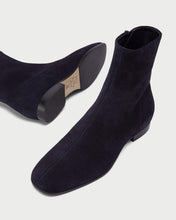 Load image into Gallery viewer, Perspective view of elegant Yuni Buffa Nightingale Suede Boot in Midnight Blue. Luxury  handcrafted clean lines and hugging fit designer squared toe boot in italian suede leather