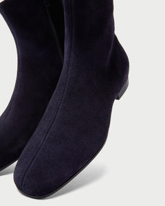 Front detail of elegant Yuni Buffa Nightingale Suede Boot in Midnight Blue. Luxury handcrafted clean lines and hugging fit designer squared toe boot in italian suede leather.