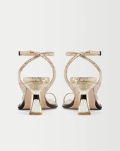 Load image into Gallery viewer, Back view of designer women&#39;s sandals Yuni Buffa Castrise strappy sandal high Heel in Comet Gold color made in Italy with Italian Lamb Nappa leather and silver logo buckle