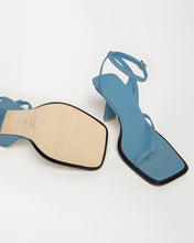Load image into Gallery viewer, Leather Bottom view of Yuni Buffa Castrise strappy sandal high Heel in Bermuda blue color handmade in Italy with Italian Lamb Nappa leather and silver logo buckle