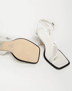Bottom and perspective view of Yuni Buffa Castrise Heel in Cloud white color made in Italy with Italian Lamb Nappa leather and silver logo buckle