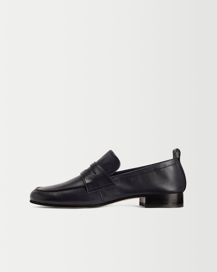 Side view of Yuni Buffa Fez Penny Loafer in Navy Blue leather. Artisanal crafted women designer loafer shoe made in Italy with Italian Lamb Nappa leather.