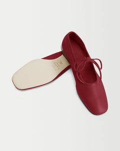 Perspective and bottom view of Yuni Buffa Lola Mary Jane Ballerina Flat shoe in Cherry Red color handmade in Tuscany, Italy with Italian Lamb Nappa leather