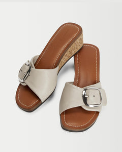 Perspective view of Yuni Buffa Lucca Sardinian cork wedge sandal shoe in Ecru white color with tan vachetta leather insole and crepe rubber outsole made in Italy with Italian Lamb Nappa leather