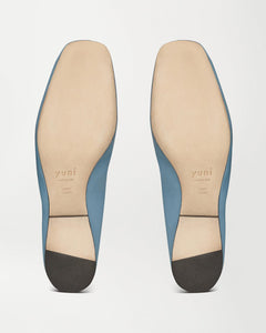 Bottom view of Yuni Buffa Pia Ballet flat designer shoe in Bermuda blue. Luxury hand made square toe ballet flats made in Italy with Italian soft Lamb Nappa leather.