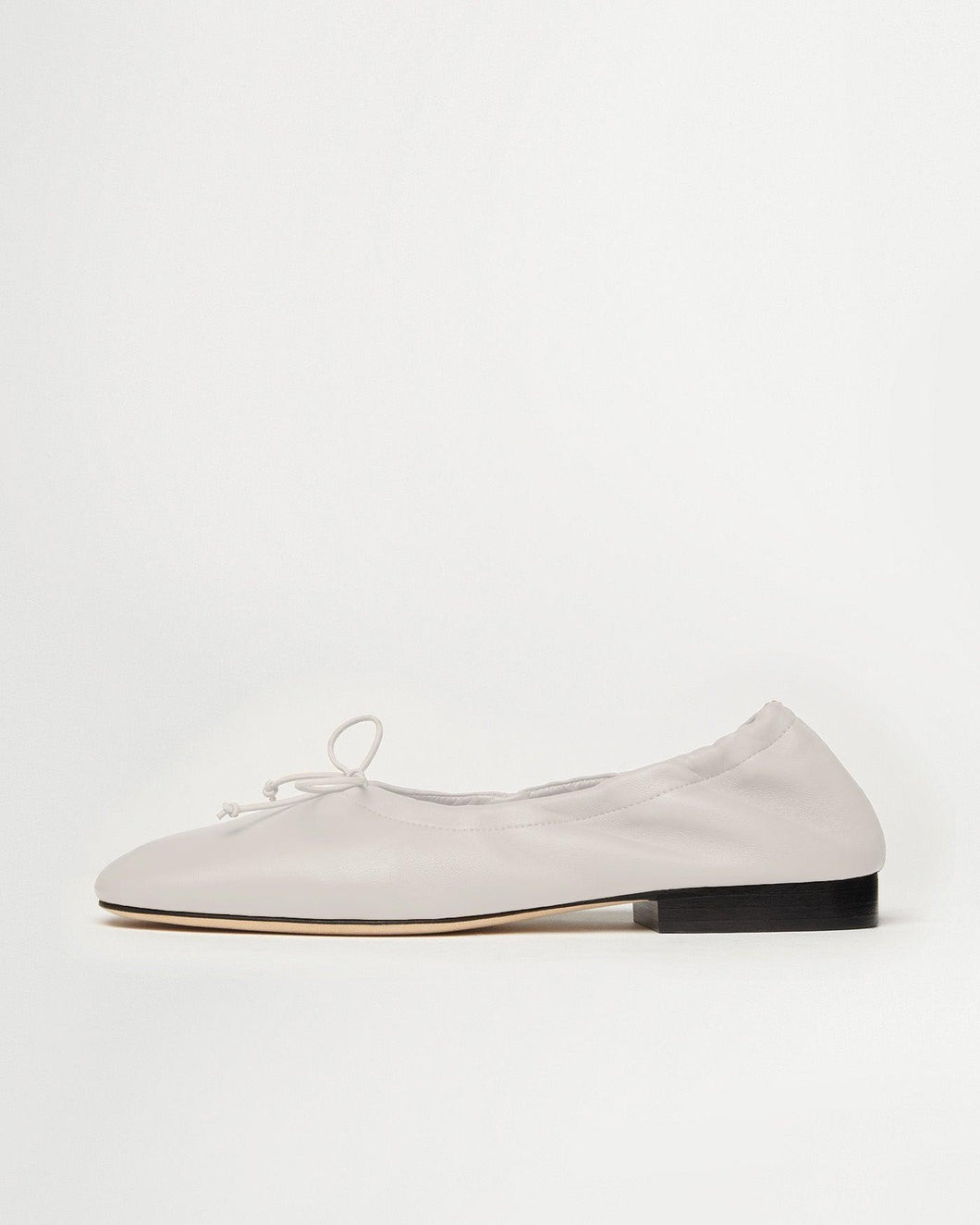 Side view of Yuni Buffa Pia Ballet flat designer shoes in Cloud White. Luxury hand crafted square toe ballet flats made in Italy with Italian soft Lamb Nappa leather.