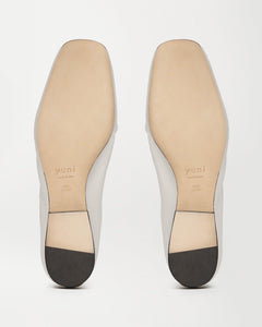 Bottom view of Yuni Buffa Pia Ballet flat designer shoe in Cloud White. Luxury handmade square toe ballet flats made in Italy with Italian soft Lamb Nappa leather.