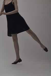 A dancer dancing in Yuni Buffa Pia Ballet flat designer shoes in Black. Luxury hand crafted square toe designer ballet flats made in Italy with Italian soft Lamb Nappa leather.
